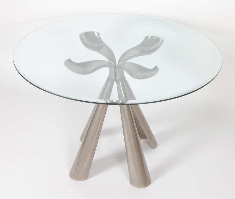 Designed by Vittorio Introini in 1972 for Saporiti of Italy is this petal formed cast aluminum dining table, the four segments are attached in the center by a interlocking design. This rare example is in amazing vintage condition with some light
