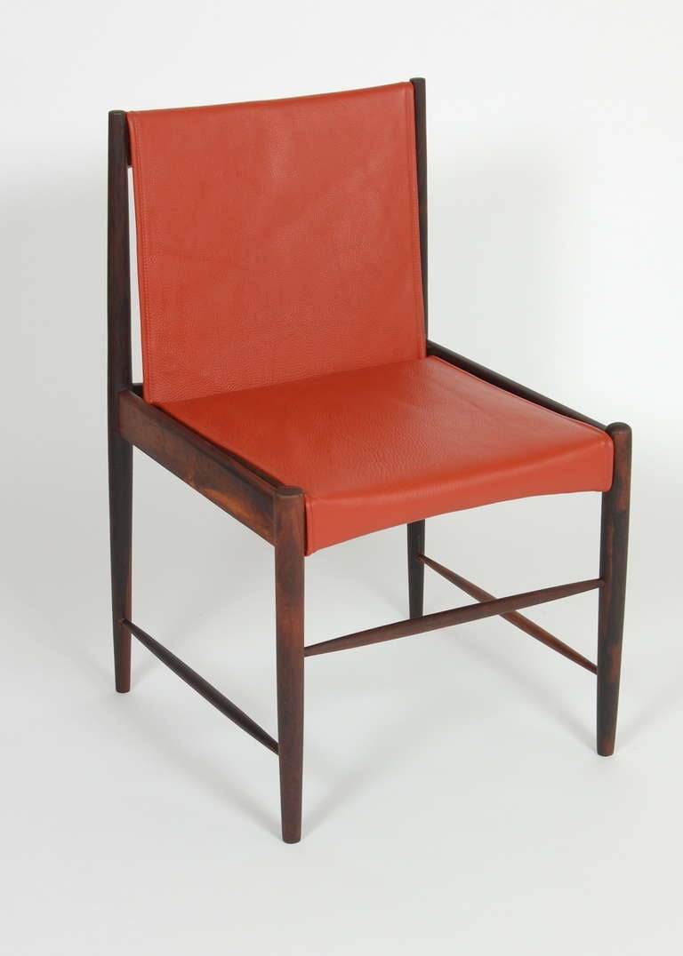 Cantu side chair created by Brazilian designer Sergio Rodrigues, rosewood frame with leather upholstery. This chair has the early makers mark craved into the frame.
