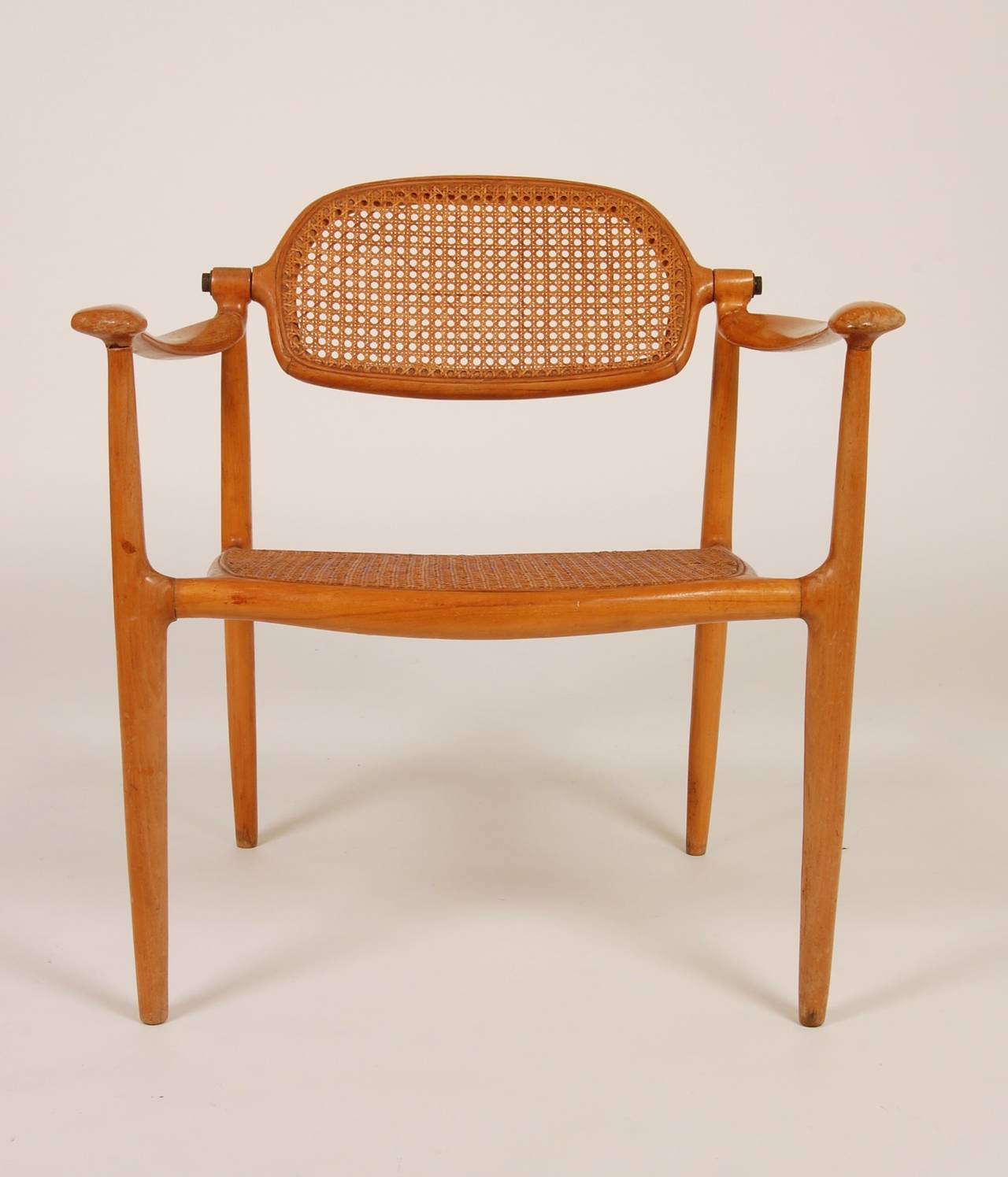 Designed and created in 1950, this was the first chair produced by Paul Tuttle with the help of a cabinetmaker friend in Santa Barbara who happened to be his neighbor. In 1951 the chair was shown in the Saint Louis Museum in the Designer-Craftsman