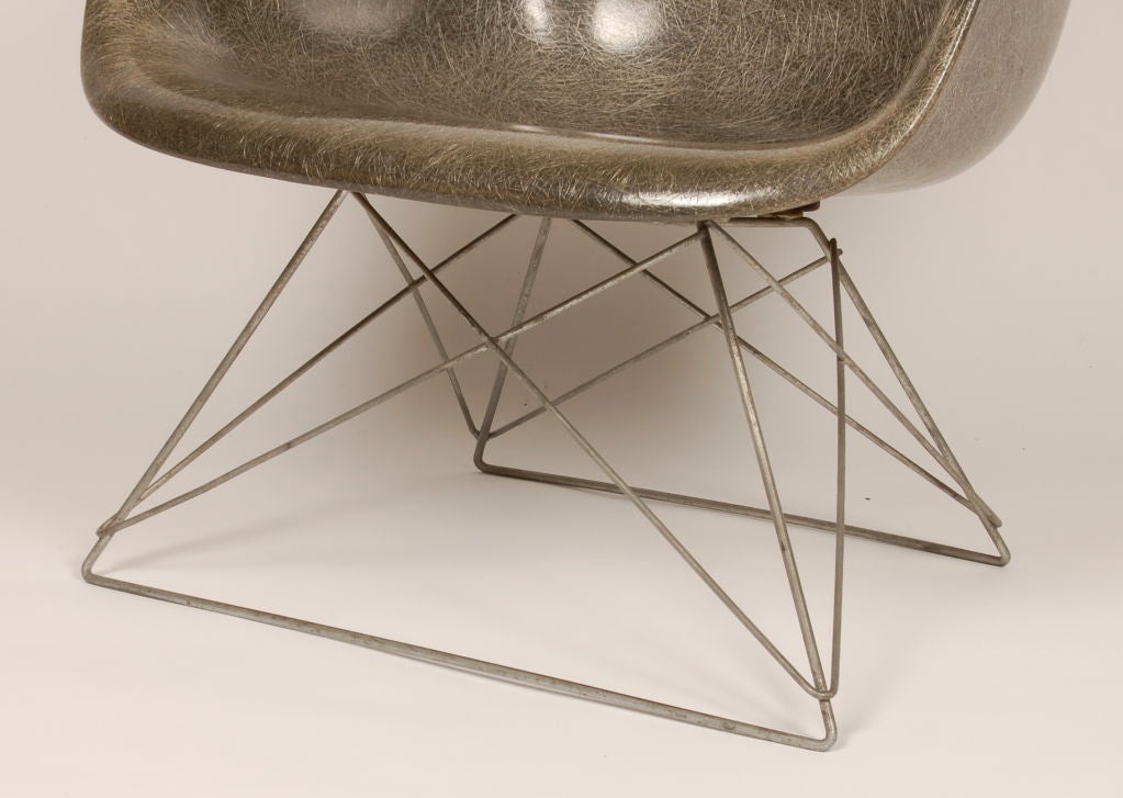 First production Eames Zenith shell chair with its original Cat's Cradle wire base. Beautiful grey color with the trademark exposed fibers of the fiberglass which was the result of the process of these early pioneer production techquies that the 