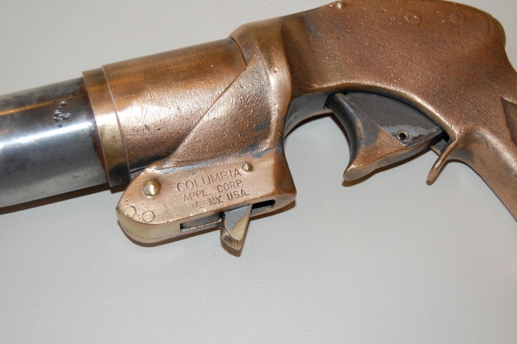 Brass and metal flare gun created during the Early 20th Century, a great example of applied industrial design.