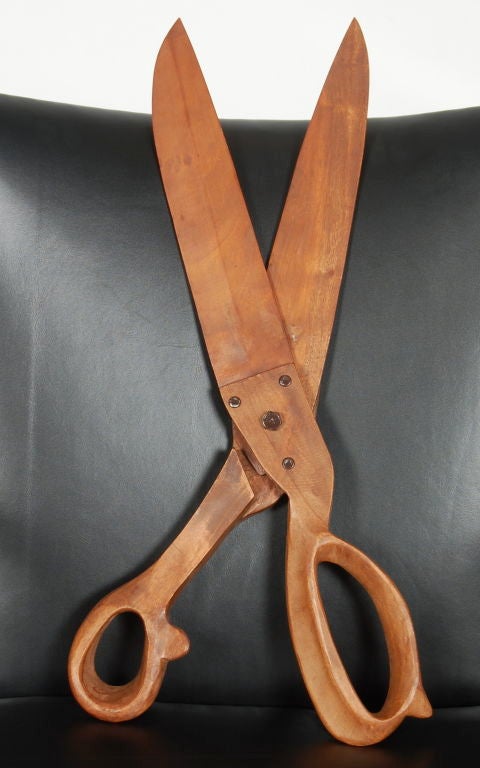 Handmade wooden scissors, a nicely crafted piece with great attention to detail.