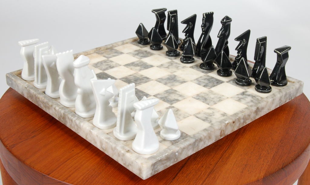 Chess set comprised of ceramic chess pieces from Belgium and the board in marble from Italy.