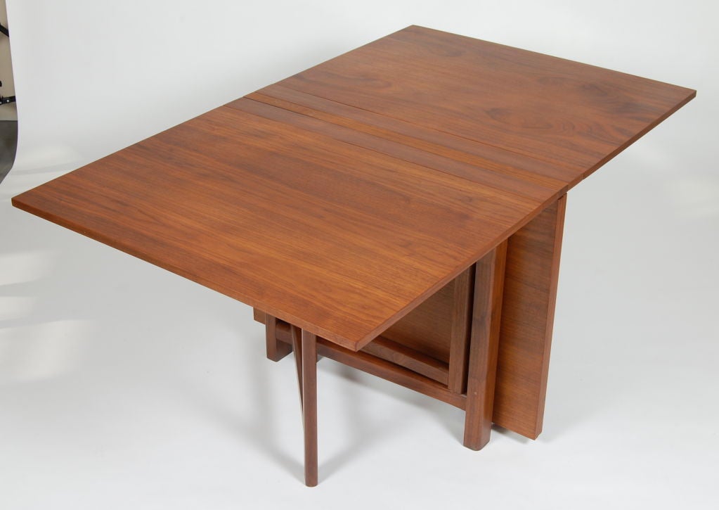 A smart design for limited space domiciles, gate-leg folding dining table which expands from 9