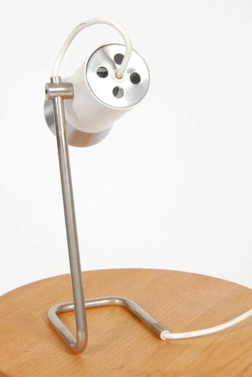 Small Italian desk task lamp, pivoting lamp head with a U shaped chromed base.