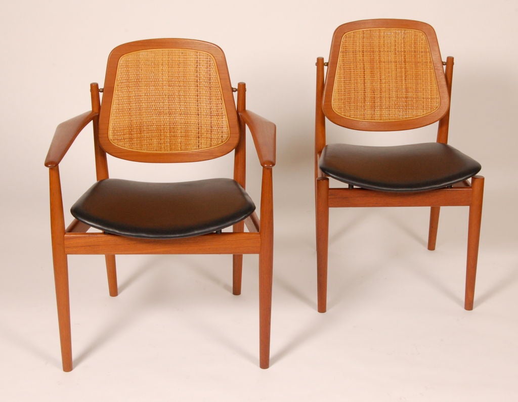 Arne Vodder for France & Daverkosen imported for John Stuart New York, model FD 185 dining chairs, consisting of two arm and six side chairs, teak frames with cane backs and new aniline leather seats. Amazingly crafted and styled chairs,