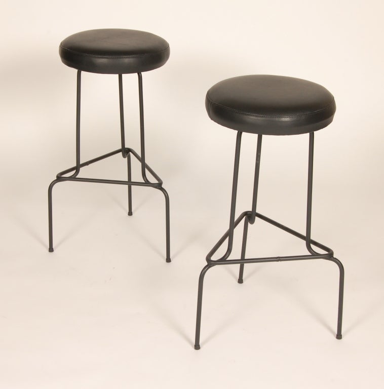 Modernist wrought iron bar stools with newly recovered leather seats. Evokes the aesthectic of the Case Study program of the early 1950s.