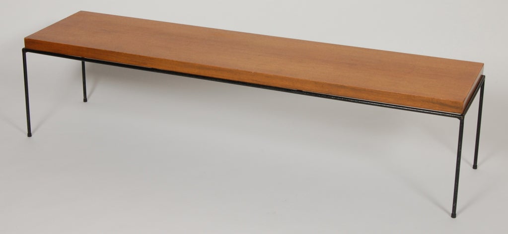 Paul McCobb bench / coffee table for his Directional Group line. Wrought iron base with a thick mahogany top, sleek minimal lines. A great all original example having a wonderful patina.