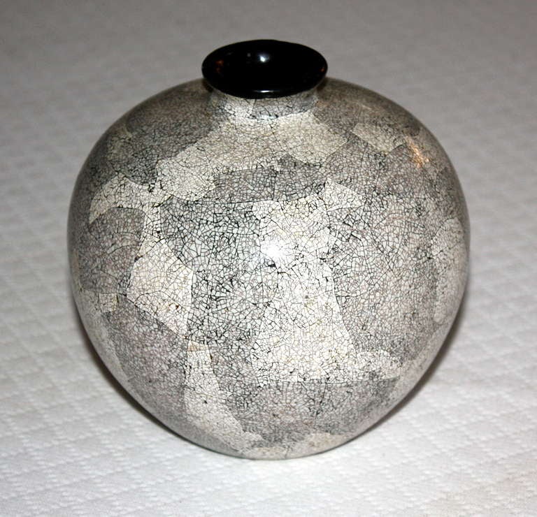 A small eggshell lacquered vase in the Art Deco style, circa 1930 France, signed indistinctly on bottom.