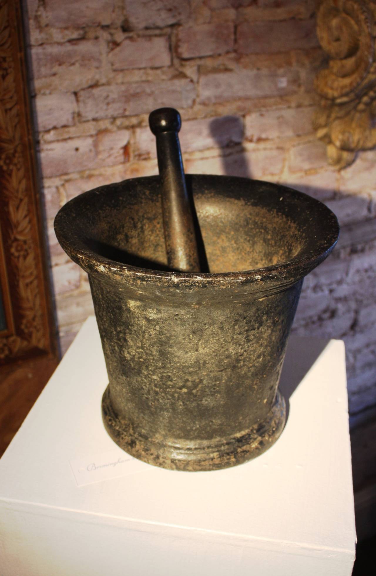 A large Civil War era Industrial mortar and pestle, circa 1860, in cast iron, with great untouched black painted finish.