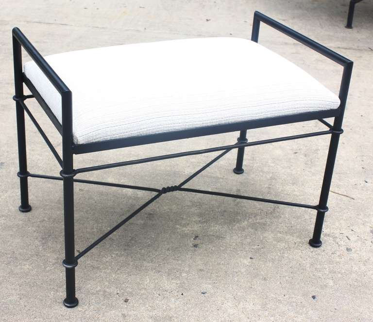 A pair of stylish modern tubular steel benches in an ebonized finish, French circa 1960, with upholstered slip seats recovered in cream colored cotton velour fabric.

Free delivery tri-state area!