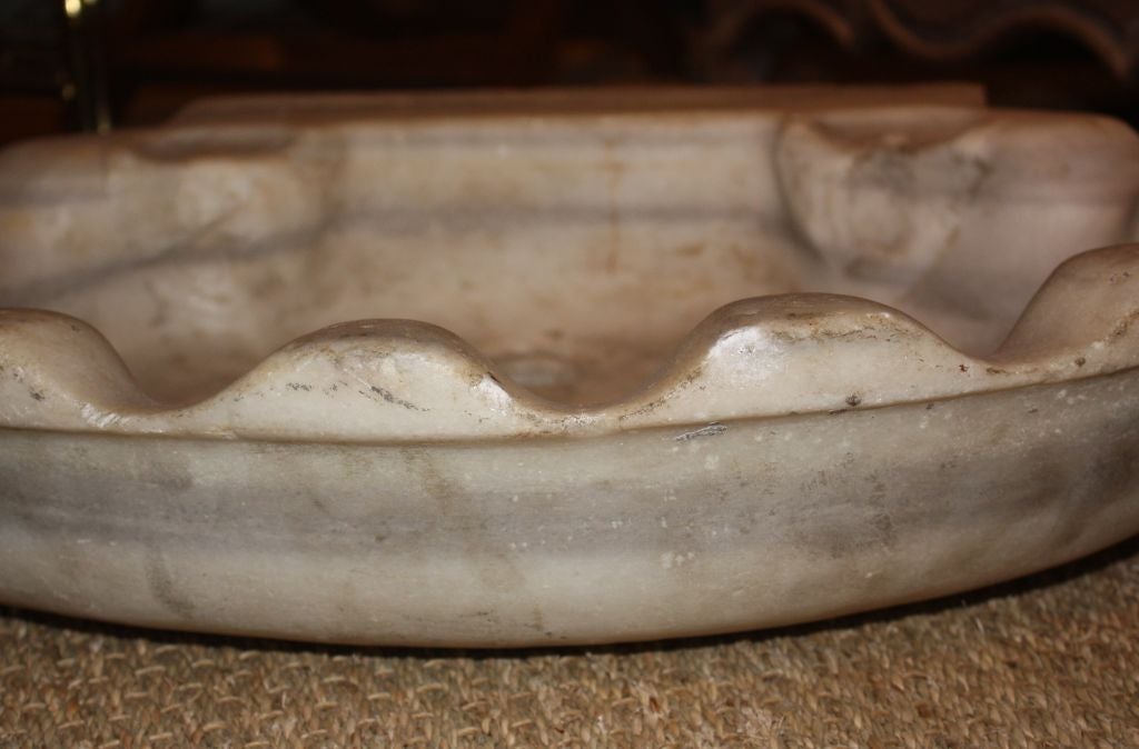 A shell-form sink basin in hand-carved marble, Italian, circa 1790, nice small size great for a powder room.