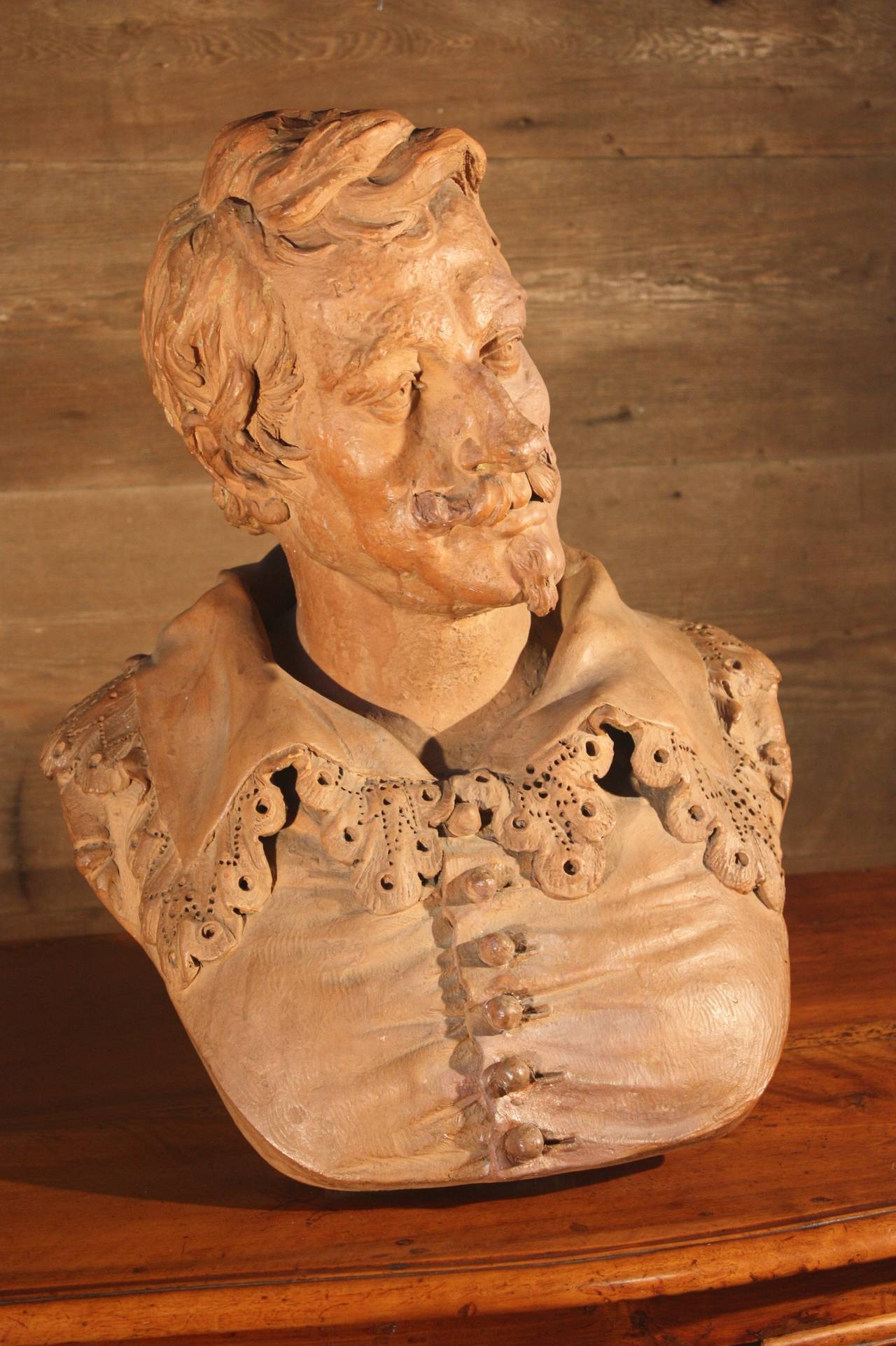 A mid-late 19th century terracotta lifesize bust of the Renaissance artist Van Dyck and signed by sculptor Alphonse Henri Nelson. Wonderful modelling and a great patina.