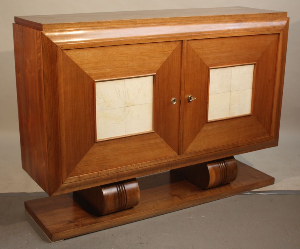 A French 1930's Art-Deco 2-door buffet in light walnut, with parquet top and parchment panels in doors.  Nice small size.
