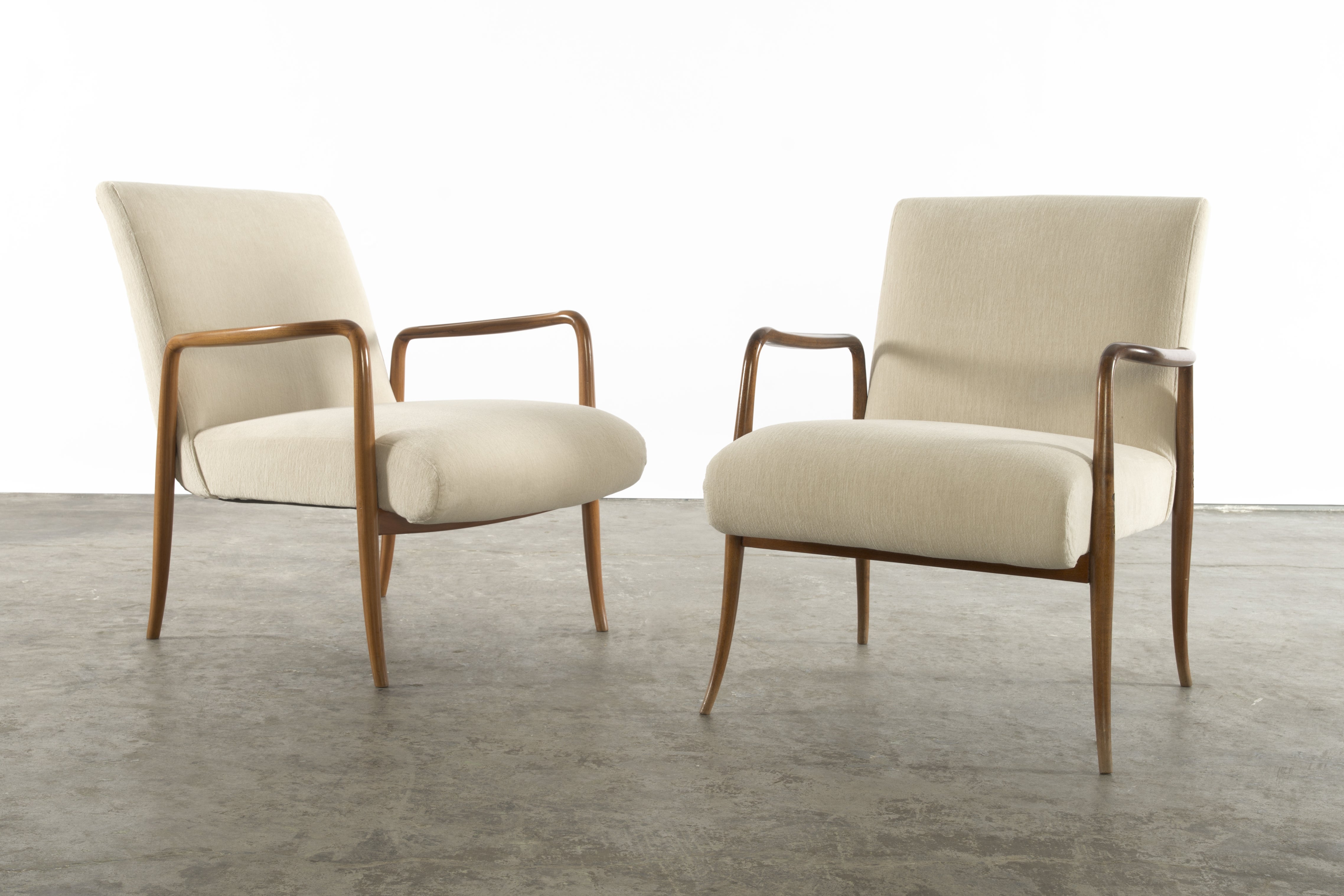 A pair of "light" chairs by Joaquim Tenreiro For Sale