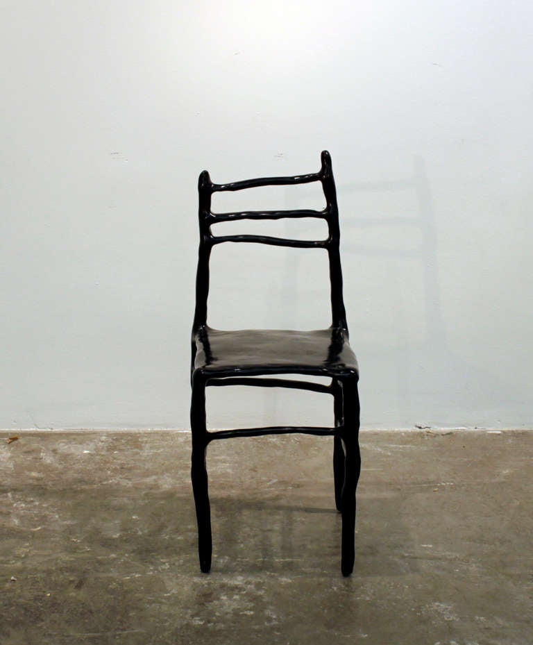 This chair was produced during a special design performance at Design Miami/Basel in 2007. Number one from the edition of five.

 Back of chair inset with metal lettering 