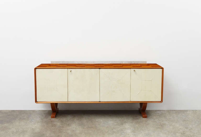 Gorgeous sideboard by Italian designer Paolo Buffa in fruitwood and vellum with brass accents.