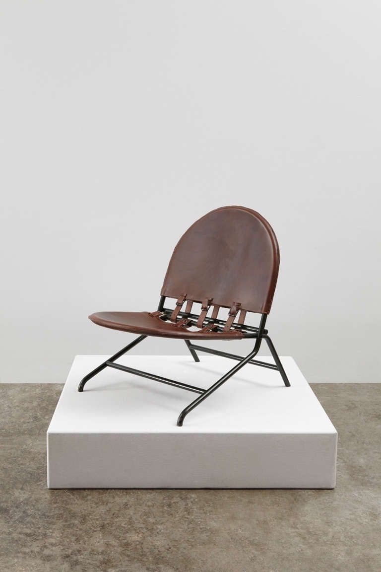Folding lounge chair in painted metal and leather designed by Ico and Luisa Parisi in 1951.