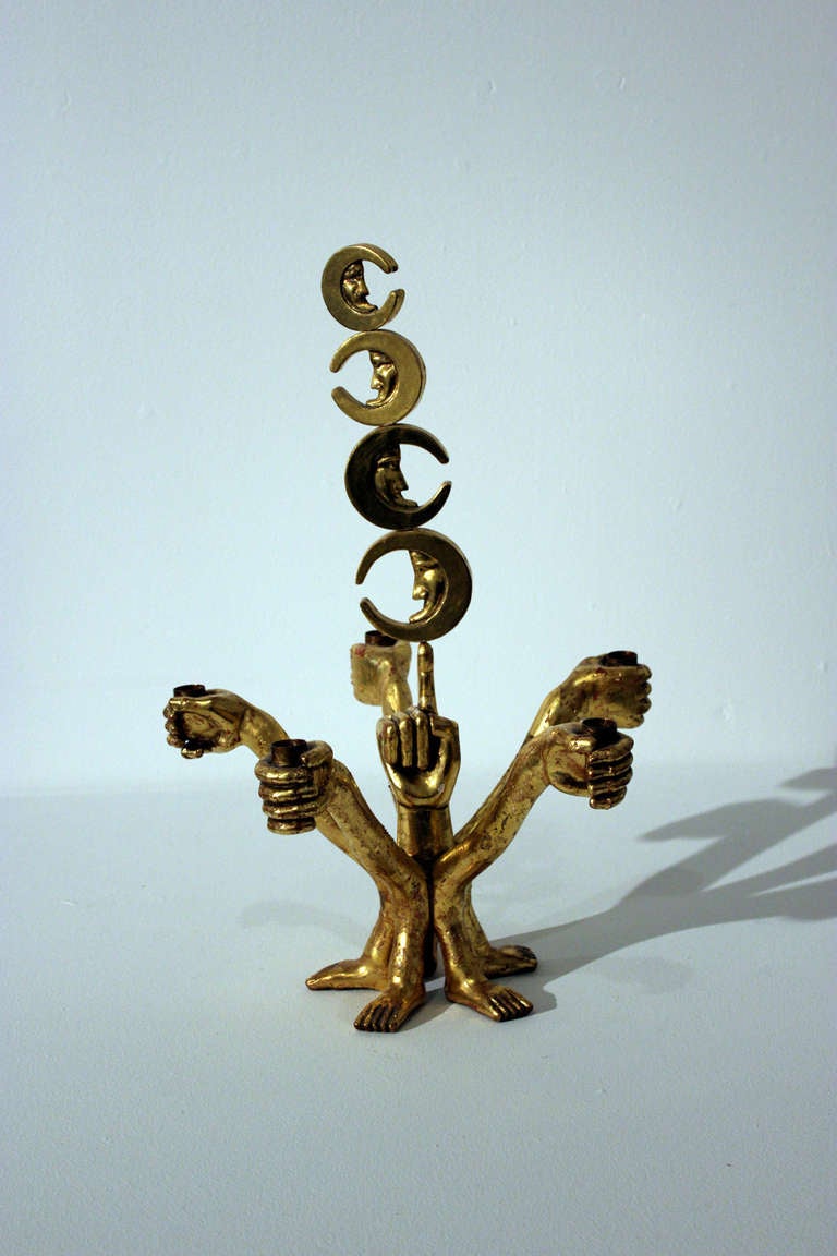 Gilt, hand-carved candelabrum comprised of hands, feet, stars and the moon holds five candles. Produced by Mexican artist and designer Pedro Friedeberg. Underside of one foot signed with 