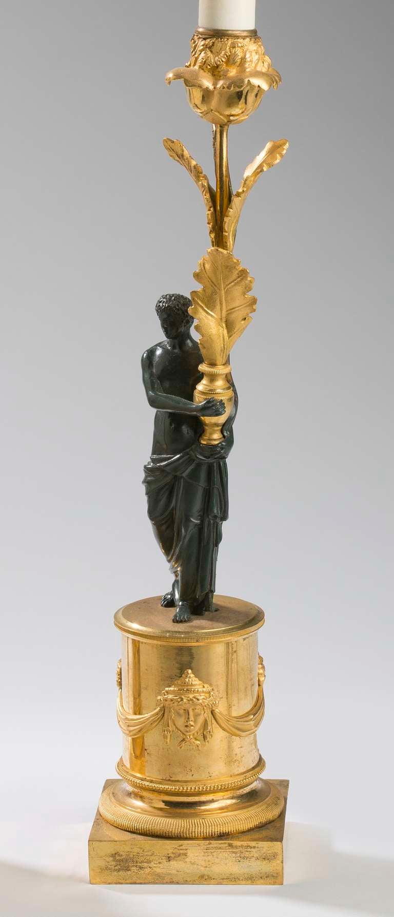 Pair of Directoire Ormolu and Patinated Bronze Figural Candlesticks
