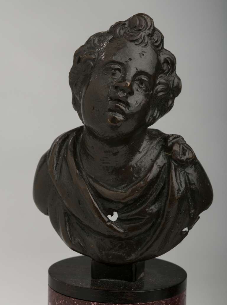 18th Century and Earlier Pair of Italian Patinated Bronze Putti on Gilt Bronze-Mounted Porphyry Bases For Sale