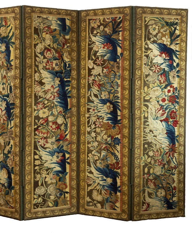 Each tapestry upholstered panel incorporating Flemish vertical tapestry fragments woven with foliate blossoms and sprays set in a later surround woven frame.