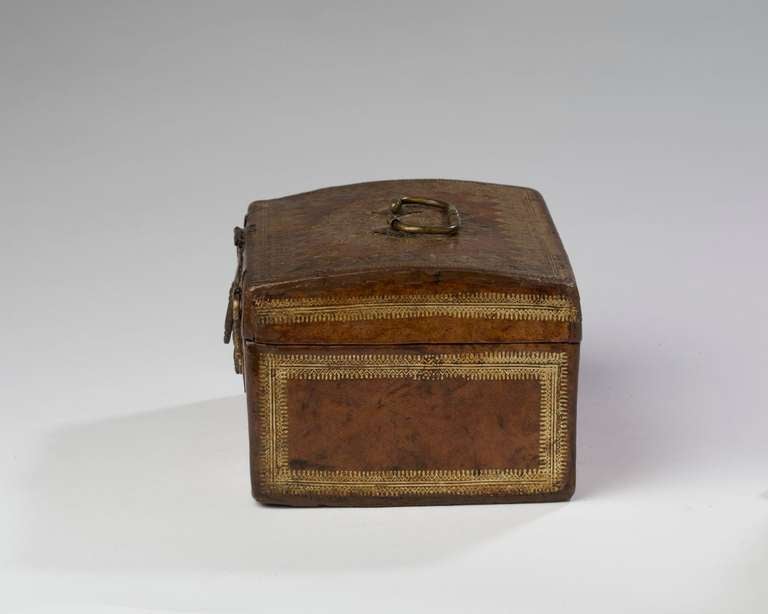 With a domed cover, the interior with red silk lining, the whole with gilt iron mounts and lock box.