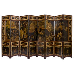 Chinese Black and Polychrome Lacquered Eight-Panel Screen