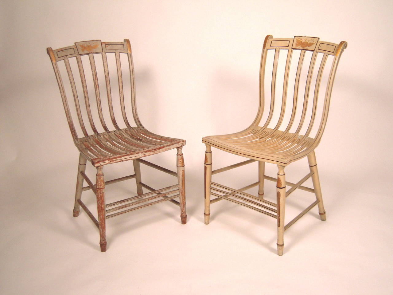 A rare pair of painted ash and hickory painted bentwood chairs by Samuel Gragg (American, 1772-1855), made in Boston, circa 1808, one with distressed early finish, the other with restored and repainted surface, as seen in photographs.

Samuel