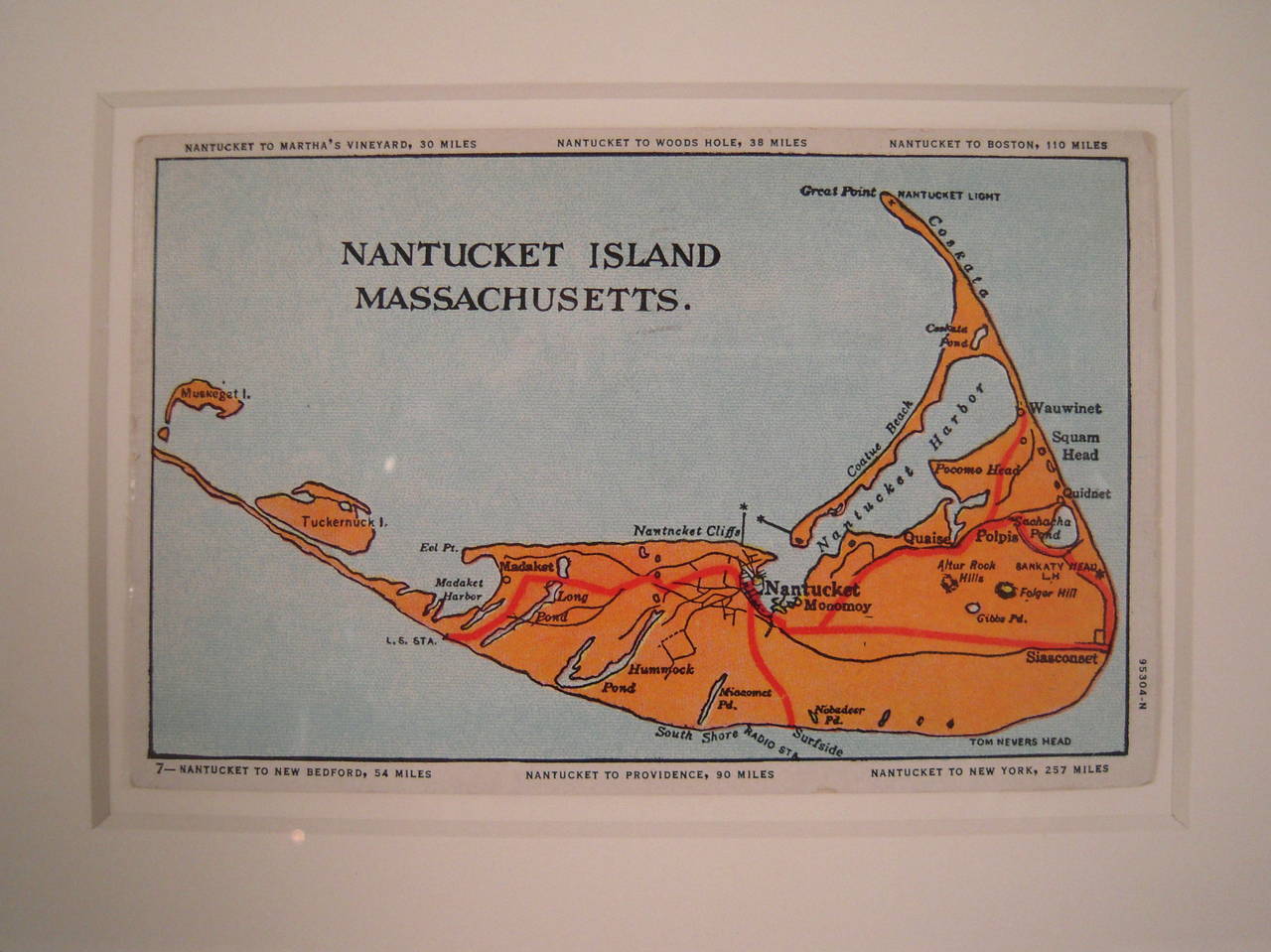 A vintage map postcard of Nantucket, circa 1952, printed in orange and red on light blue with black text identifying locations and distances of the island to surrounding areas, including Boston, New York, Wood's Hole and Martha's Vineyard. New, high