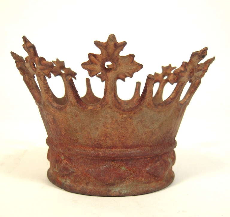A 19th Century European cast iron santos crown.