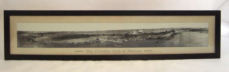 A rare, large panoramic black and white photograph of the Havana Cuba Country Club, circa 1910, in original dark stained oak frame with matte with calligraphy caption. Signed lower right 'American Photo Company, Obispo 70, Havana, Cuba
