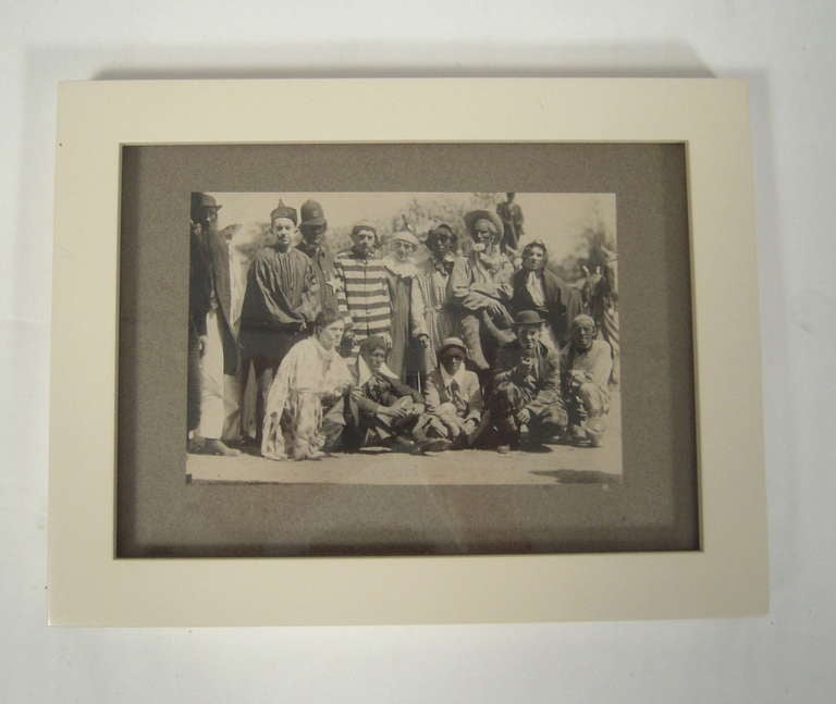A photograph of costumed men at a masquerade party, circa 1910. Newly, archivally framed in cream lacquered frame with UV-resistant glass.

8 1/4