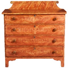 A New England Paint Decorated Chest of Drawers, circa 1825