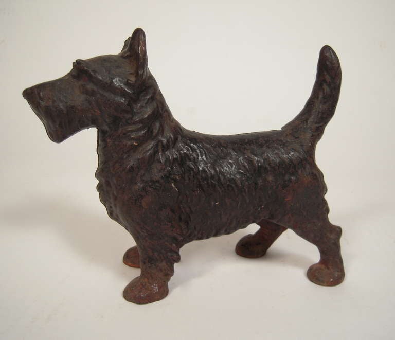 A black painted cast iron Scottie doorstop attributed to Hubley, American, circa 1920s-40s.