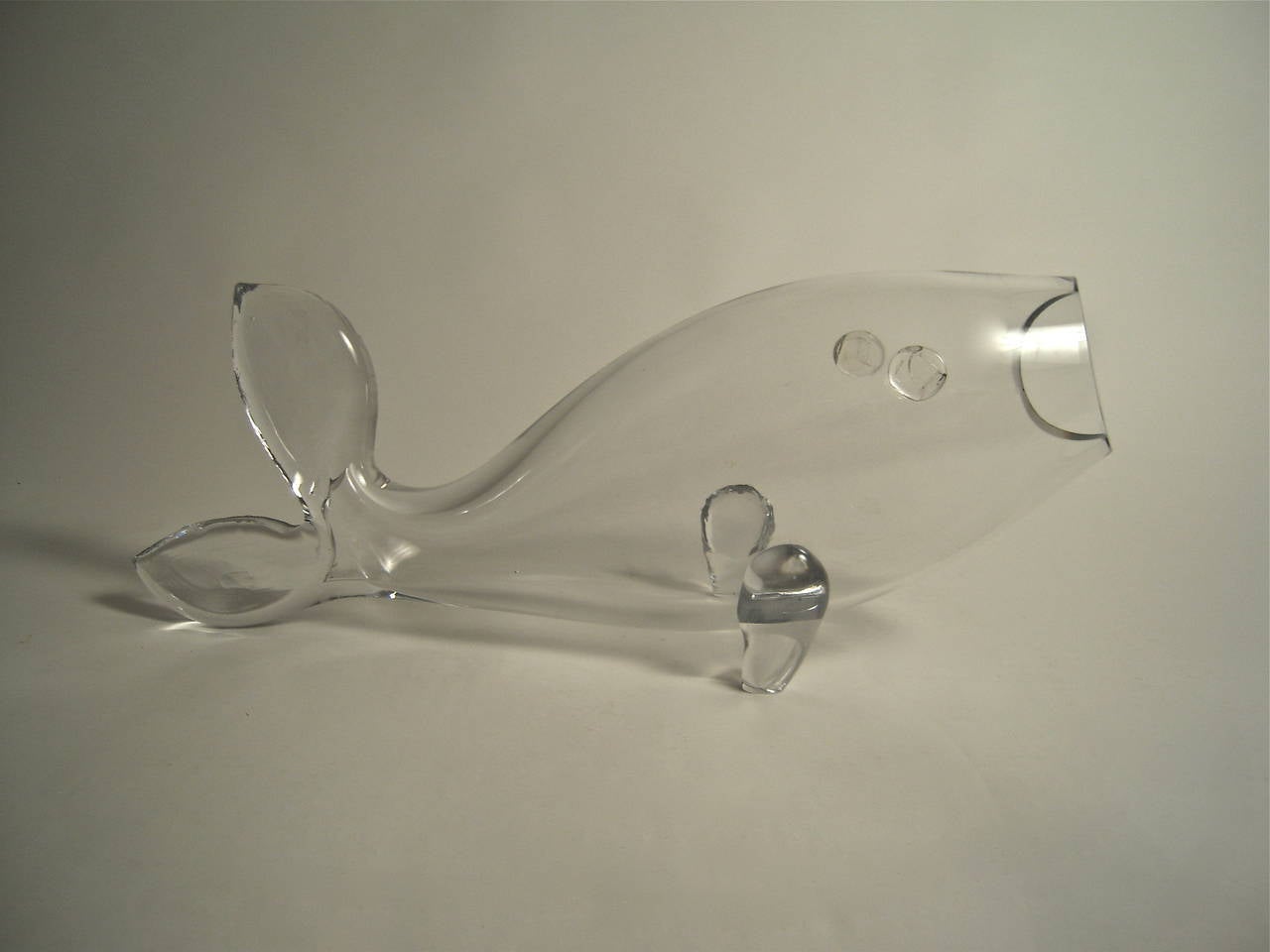 A vintage American mid-century modern clear blown glass sculpture of a large fish, by Blenko.
