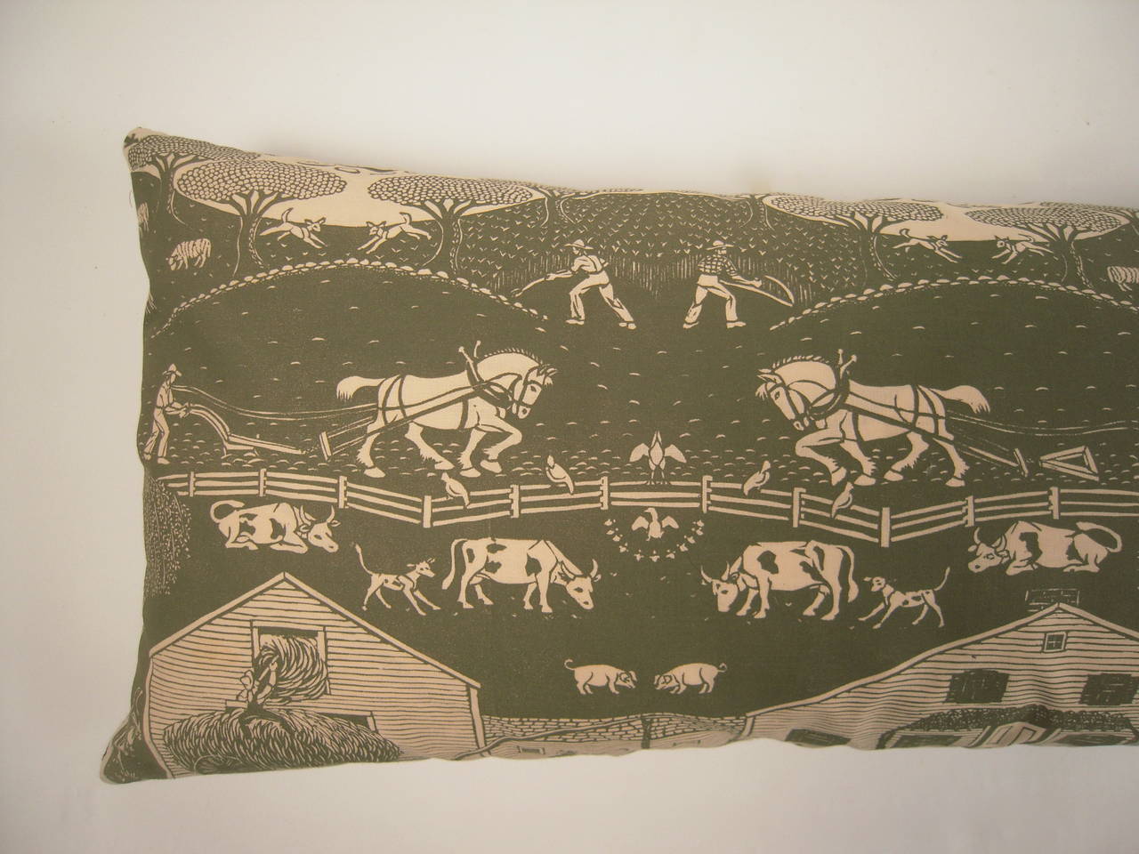 A rare Folly Cove Designers hand block printed rectangular pillow in the New England Farm pattern, designed by Eino Natti, circa 1954, in olive green on cream cotton, newly down filled and backed with olive green linen. In perfect, mint