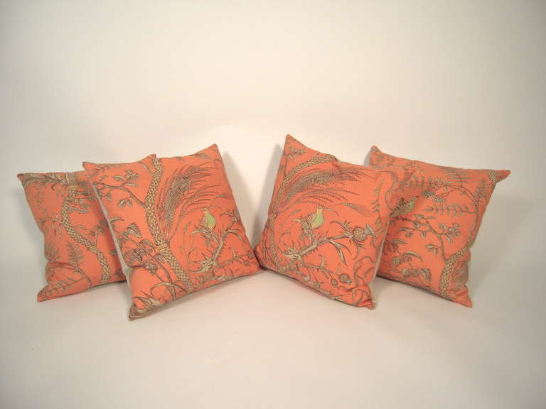 Vintage Brunschwig & Fils fabric Bird and Thistle pattern pillows, in complex color way no longer made, the celadon green, yellow, grey and blue branch, leaves and bird on a salmon cotton ground, backed with blue-grey silk and down-filled.

4