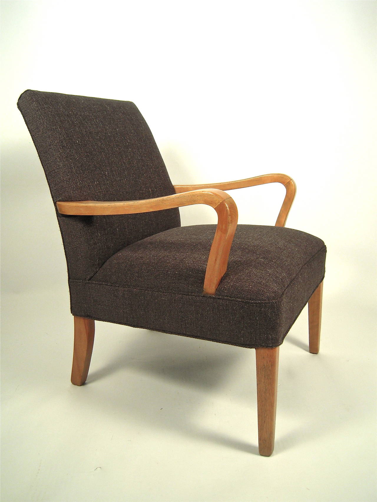 A very comfortable, well made American Mid-Century Modern bentwood upholstered armchair, the sculptural arms in curved maple or birch, the seat and back newly reupholstered in high quality charcoal grey linen and wool, raised on four square section