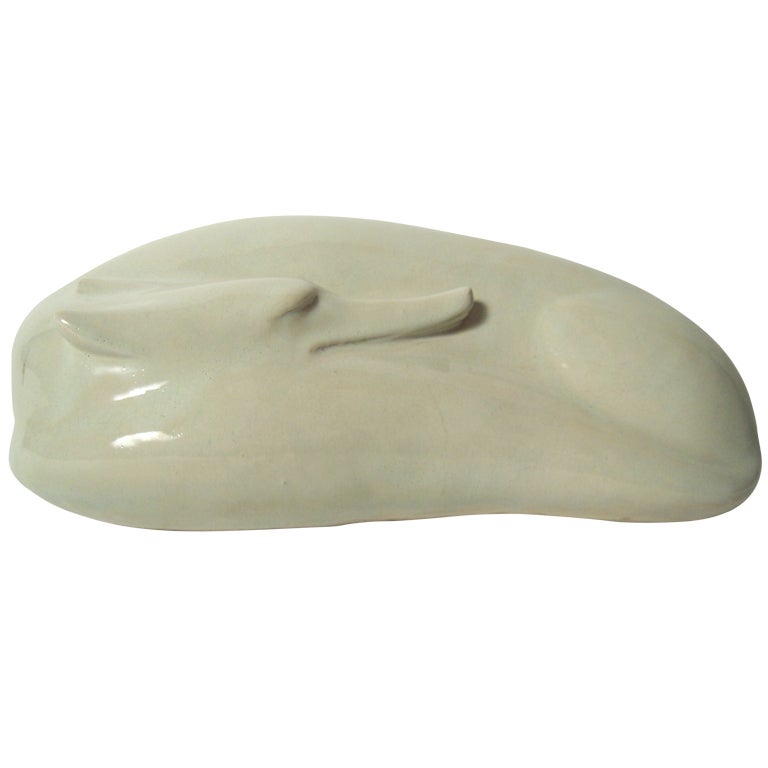 A Japanese Art Pottery Sleeping Fox Sculpture