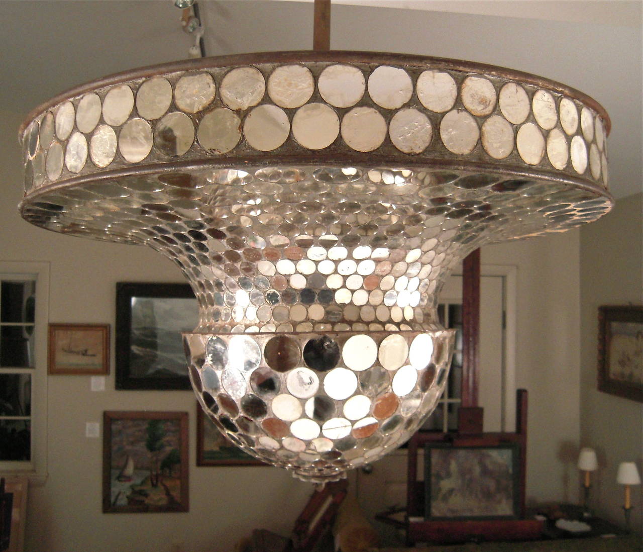 A rare working rotating mirrored ballroom light (early disco ball) with quarter-sized circular mirrored tiles on a metal base with original electric motor.  Suspended by a metal rod with canopy for ceiling mount. Spins well and creates a fabulous