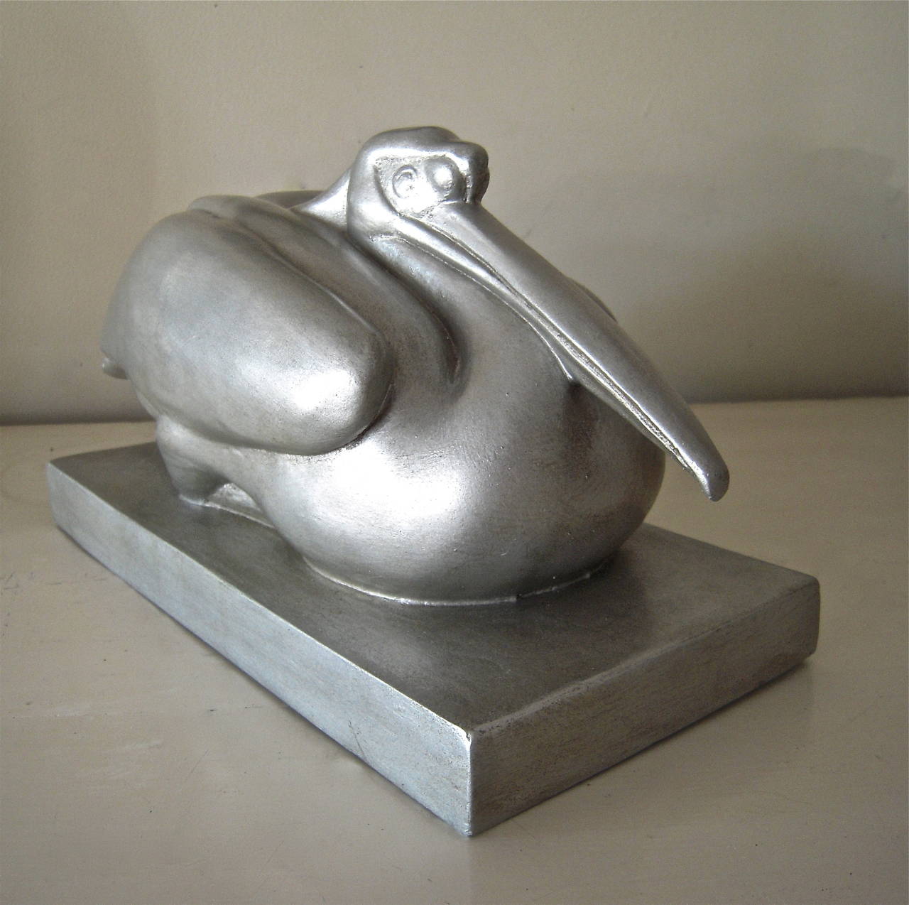 Katharine (Kay) Lane Weems (American, 1899-1989) silver painted plaster figure of a seated pelican, originally modeled in 1942. This example is a Skylight Studios casting, circa 1990. 

Height: 6
