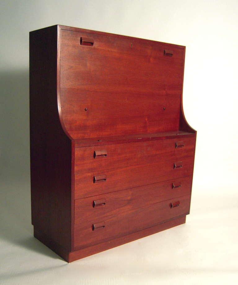 A Danish fall-front secretary designed by Borge Mogensen for Soborg Mobelfabrik, Denmark, circa 1950's. This handsome teak case piece provides a significant amount of well organized storage in combination with work space. The fall front encloses a