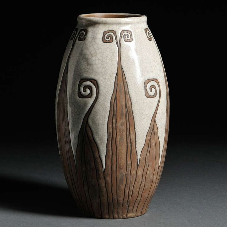A fine stoneware vase designed by Charles Catteau for Gres  Keramis, Belgian, circa 1930, the matte brown stylized, geometric leaf decoration in resist on a glazed gray crackled ground. Marked 