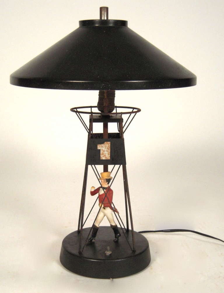 A 1960s Johnnie Walker buoy lamp in painted metal and plaster.