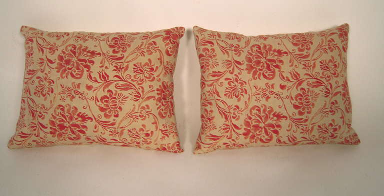 A pair of antique red and buttery cream Fortuny fabric rectangular pillows, down filled and backed with cotton and linen blend, in a beautiful, variegated floral and foliate pattern.<br />
For another, slightly larger pair, see item LU83771231842 in