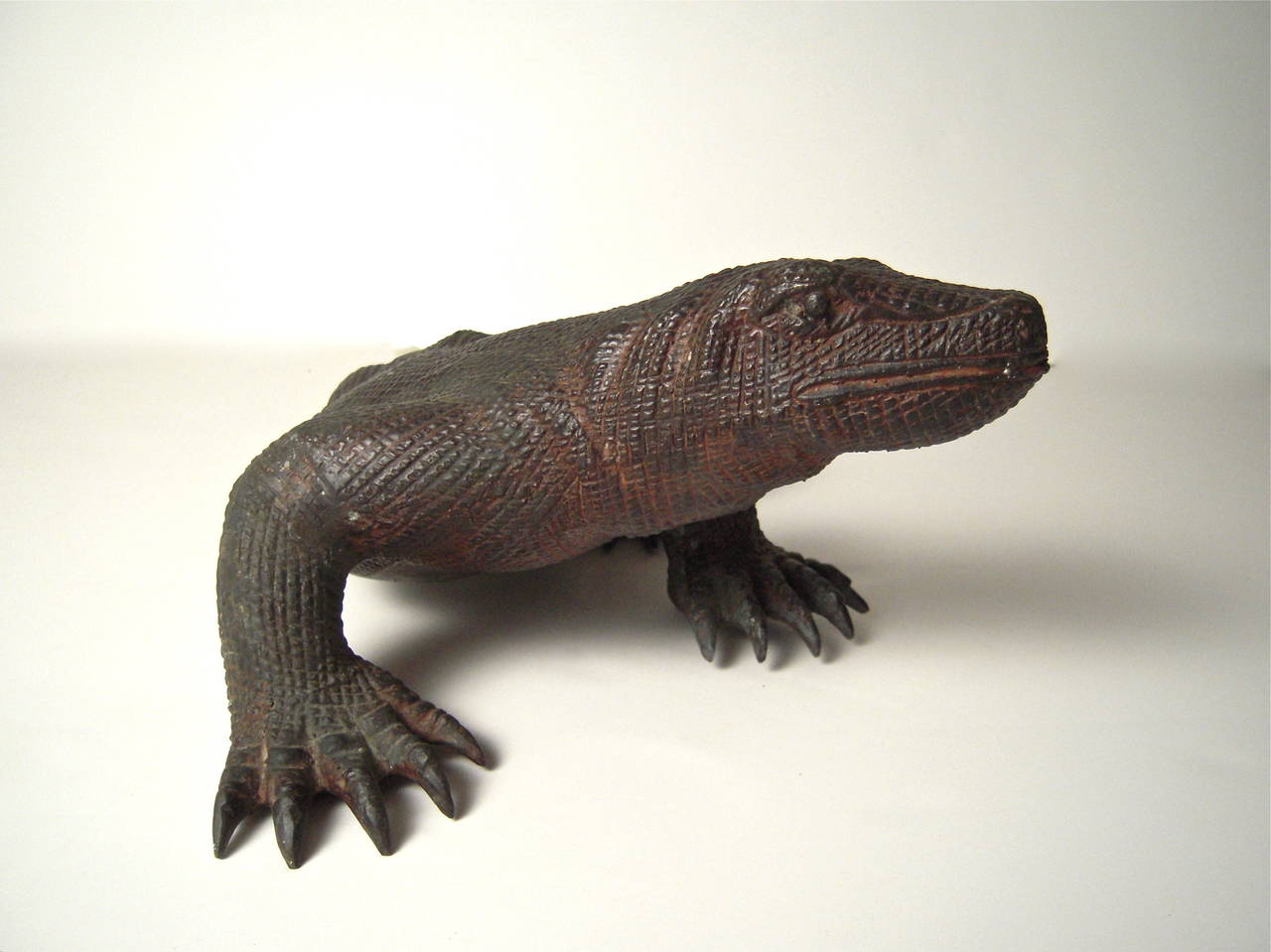 A well modeled, highly naturalistic, sculpture of a Komodo dragon, handmade in copper or copper alloy. Very realistic, with good age and patina.

Dimensions:

Height: 5 1/2