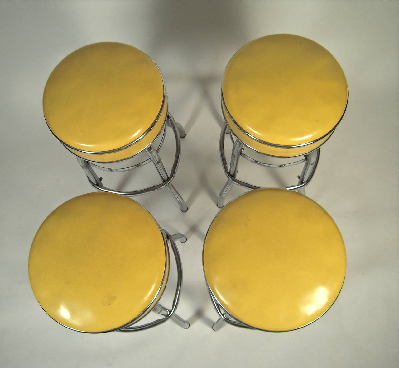 Mid-Century Modern Set of 4 1950s Metal and Yellow Swivel Bar Stools