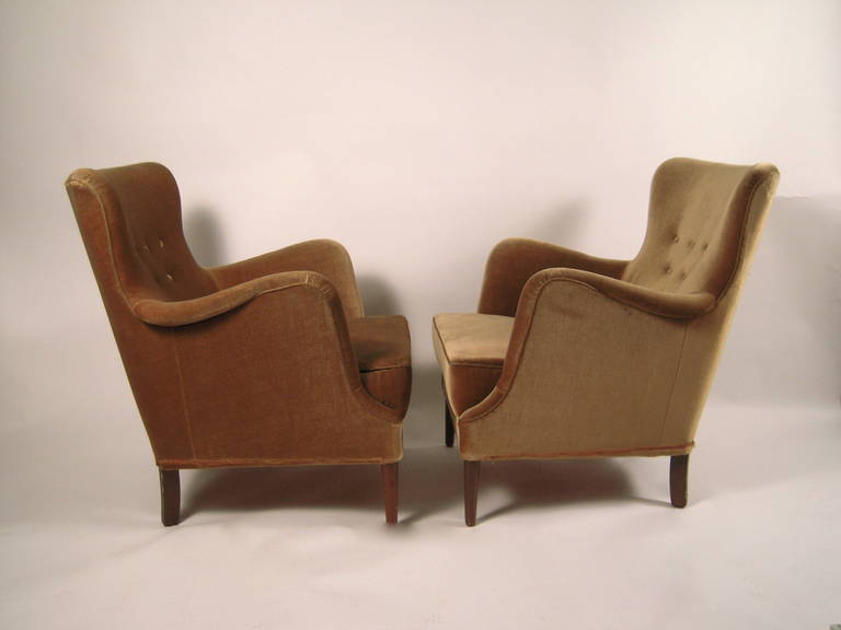 A pair of Carl Malmsten 'Samsas' ('Togetherness' in Swedish) chairs, of wonderful organic, curved form, small scale, yet very comfortable, in their original olive colored mohair upholstery with walnut stained legs.