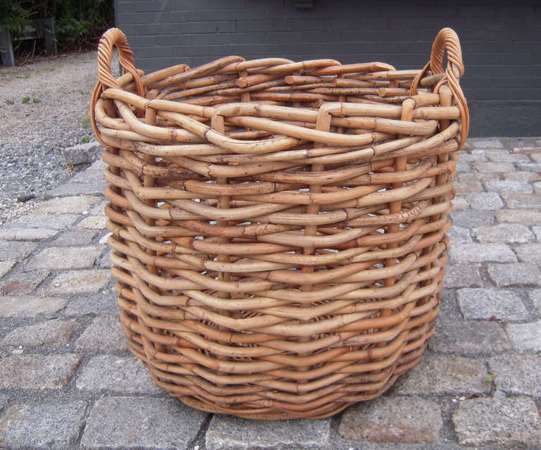 A large, sturdy bamboo basket, perfect for firewood storage or a large plant.<br />
 28